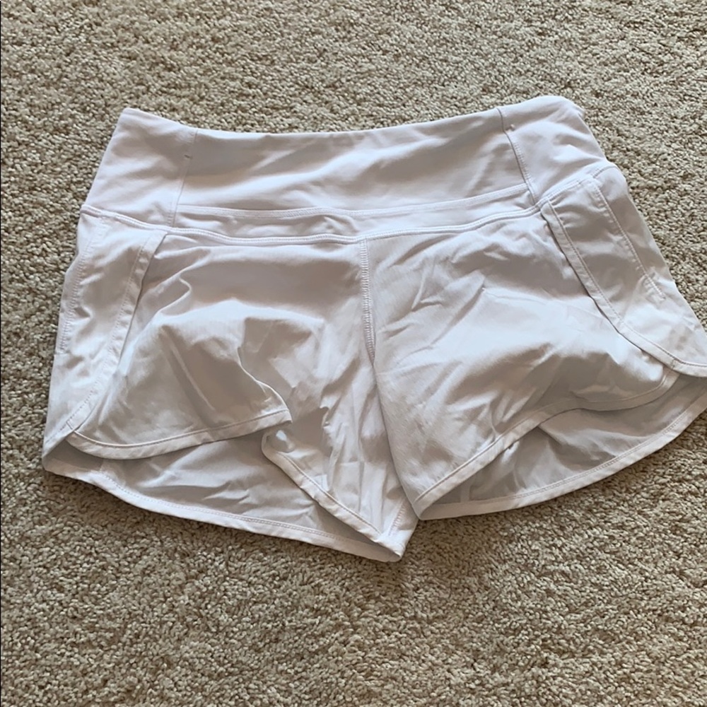 White Lululemon tracker short.